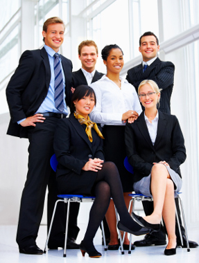 Relaxed well dressed multicultural business team - some sitting - some standng